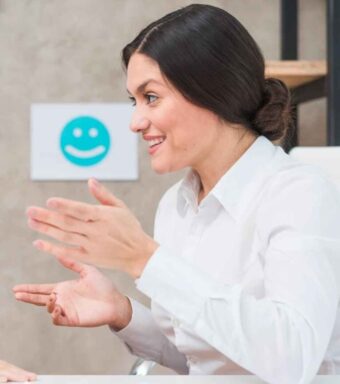 A speech therapist smilling at students